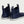 Rear view of navy blue Huk ankle boots with white soles and pull tabs