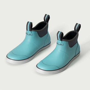 Huk teal ankle boots with grey soles and pull tabs