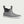 Grey ankle height Huk rubber boot with white sole and black pull tabs