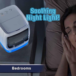 Ontel Arctic Air portable cooler with blue night light on a bedside table next to a sleeping person