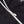 Close up of white zipper on black Mobile Warming jacket