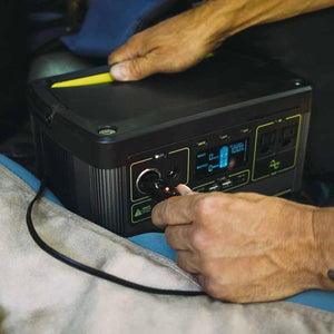 Ignik portable power station with digital display showing 100 percent charge