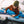 Person in a tent using an Ignik heated sleeping bag controller connected to a portable power station