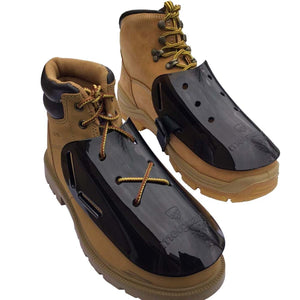 Metguard black plastic metatarsal guards attached to tan leather work boots