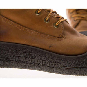 Close up of brown leather Impacto work boot with textured black sole