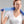 Woman wearing a blue Miracool cooling towel around her neck