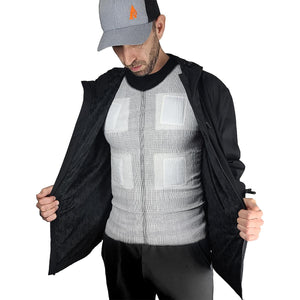 Man wearing a black jacket over a white compression vest with rectangular padding