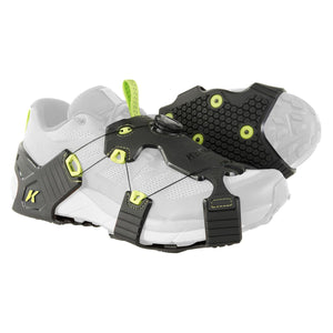 Korkers traction cleats attached to a white running shoe