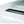Thule roof rack mounting track on a white vehicle roof