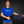 Woman wearing a blue ThermApparel t-shirt holding a black cooling belt