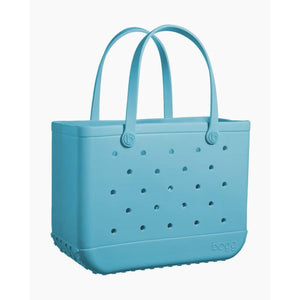 Light blue Bogg Bag tote with perforated holes and two handles