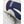 Close up of a white and blue Hestra ski glove with grey suede palm detail