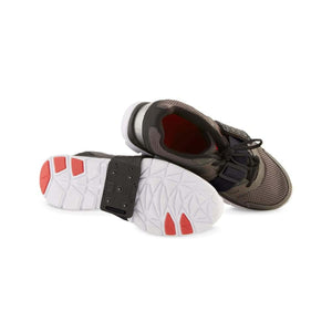 K1 Ice Cleats attached to the sole of a grey athletic shoe