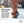 K1 Series ice traction cleats with 10 tungsten carbide spikes on a boot walking on snow