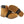 K1 Ice Cleats attached to a tan work boot showing the metal spikes on the sole