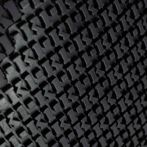 Close up of K1 Ice Cleats tread pattern with repeating logo texture