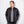 Man wearing a black Venture Heat quilted puffer jacket over a grey v-neck shirt