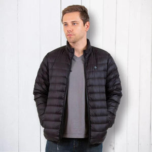 Man wearing a black Venture Heat quilted puffer jacket over a grey v-neck shirt