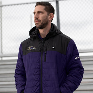 Man wearing a purple and black ActionHeat Baltimore Ravens heated jacket