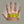 Hand being measured with a yellow tape measure