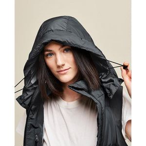 Person wearing a black Kelvin hooded vest with adjustable drawstrings