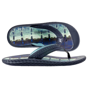 Kukui DeYoung flip flops in navy with blue and green patterned footbed
