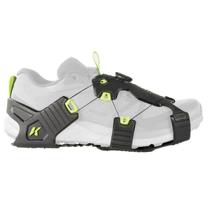 Korkers traction device attached to a white athletic shoe