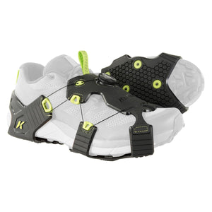 Korkers traction cleats attached to a white running shoe