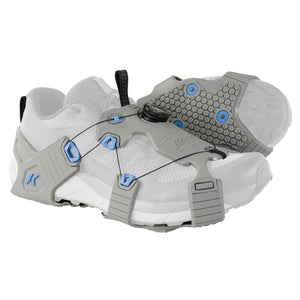 Korkers traction cleats on a white running shoe