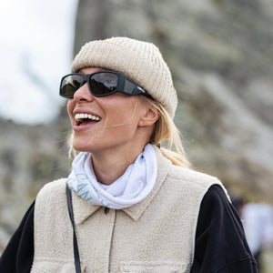 Person wearing Smith sunglasses and a beige beanie