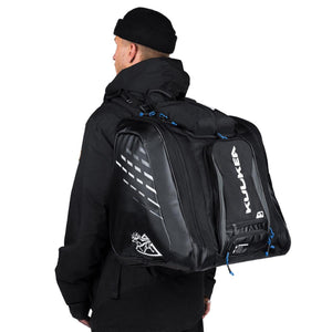 Person wearing a black Kulkea ski boot backpack