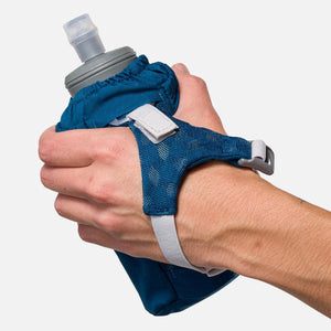 Nathan blue handheld water bottle with adjustable mesh strap held in hand