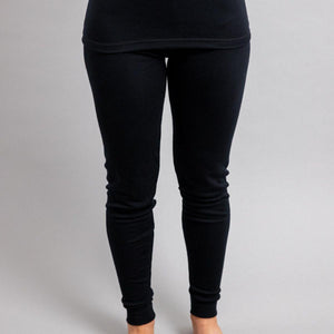 Merino Skins black thermal leggings worn by a person