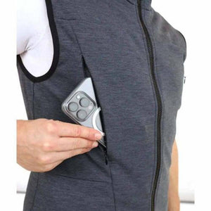 Person placing a smartphone into the zippered chest pocket of a grey Lenz vest