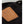 Tan leather patch with embossed think about text on black fabric