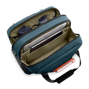 Open Briggs and Riley blue laptop bag with internal compartments holding a laptop and accessories