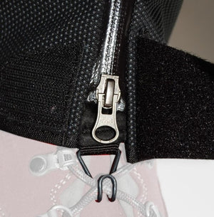 Close up of a YKK zipper on a black gaiter with a hook attachment