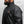 Man wearing a black California Heat jacket with a high collar