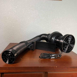 Mattress Cooler fan unit with flexible ducting and power cord on a wooden surface