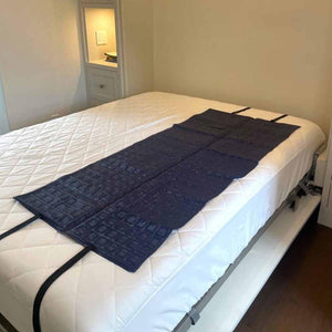 Mattress Cooler cooling pad laid flat on a white mattress