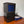 Mattress Cooler unit with power adapter and blue tubing on a wooden surface