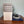 Mattress Cooler unit with power adapter and blue cooling mat on a wooden surface