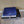 Mattress Cooler unit with a blue grid patterned cooling pad folded on top