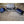 Mattress Cooler portable cooling units and folded grey quilted mattress pad on tiled floor