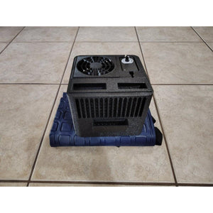 Mattress Cooler unit with black fan housing and control dial on a blue cooling pad