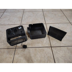 Mattress Cooler fan unit base and filter components disassembled on a tiled floor