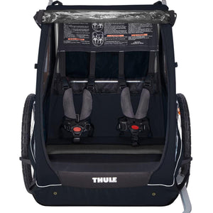 Interior view of Thule bike trailer with two padded safety harnesses