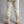 Back view of Merino Skins cream merino wool thermal leggings on a person