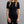 Woman wearing a black Merino Skins short sleeve crew neck shirt