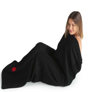 Person wrapped in a black MiHigh sauna blanket